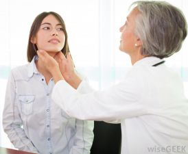 female-doctor-checking-thyroid-gland-of-female-patient
